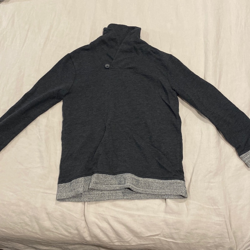 Gray jumper, in size large for children, but fits a size small adult.
